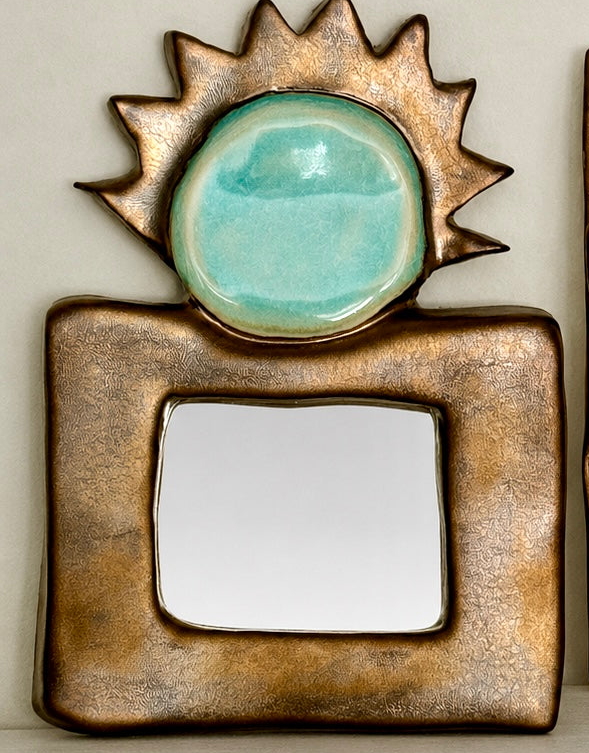 Sun-face ceramic mirror
