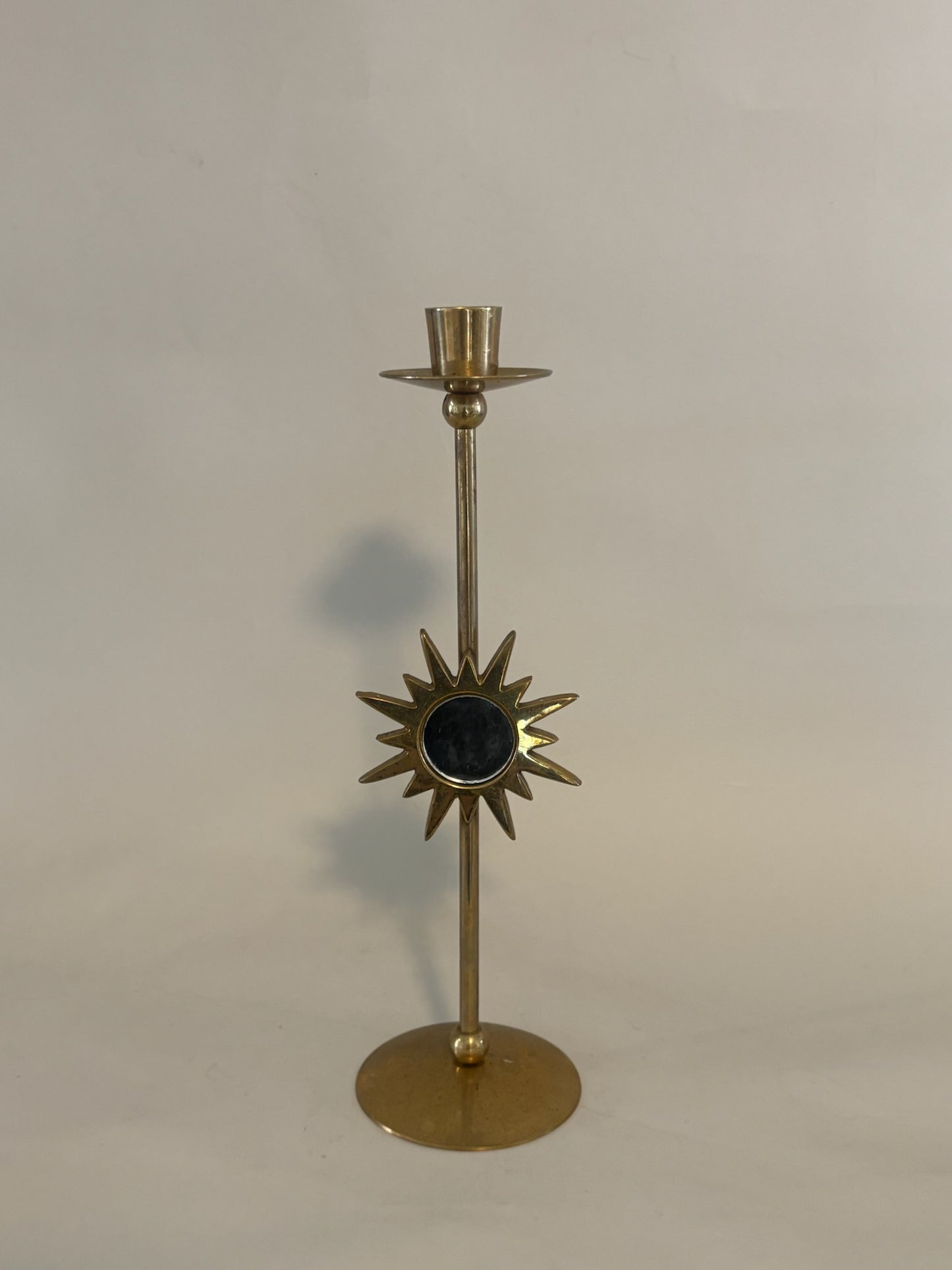 Mid-century brass candle holder with mirrored sunburst