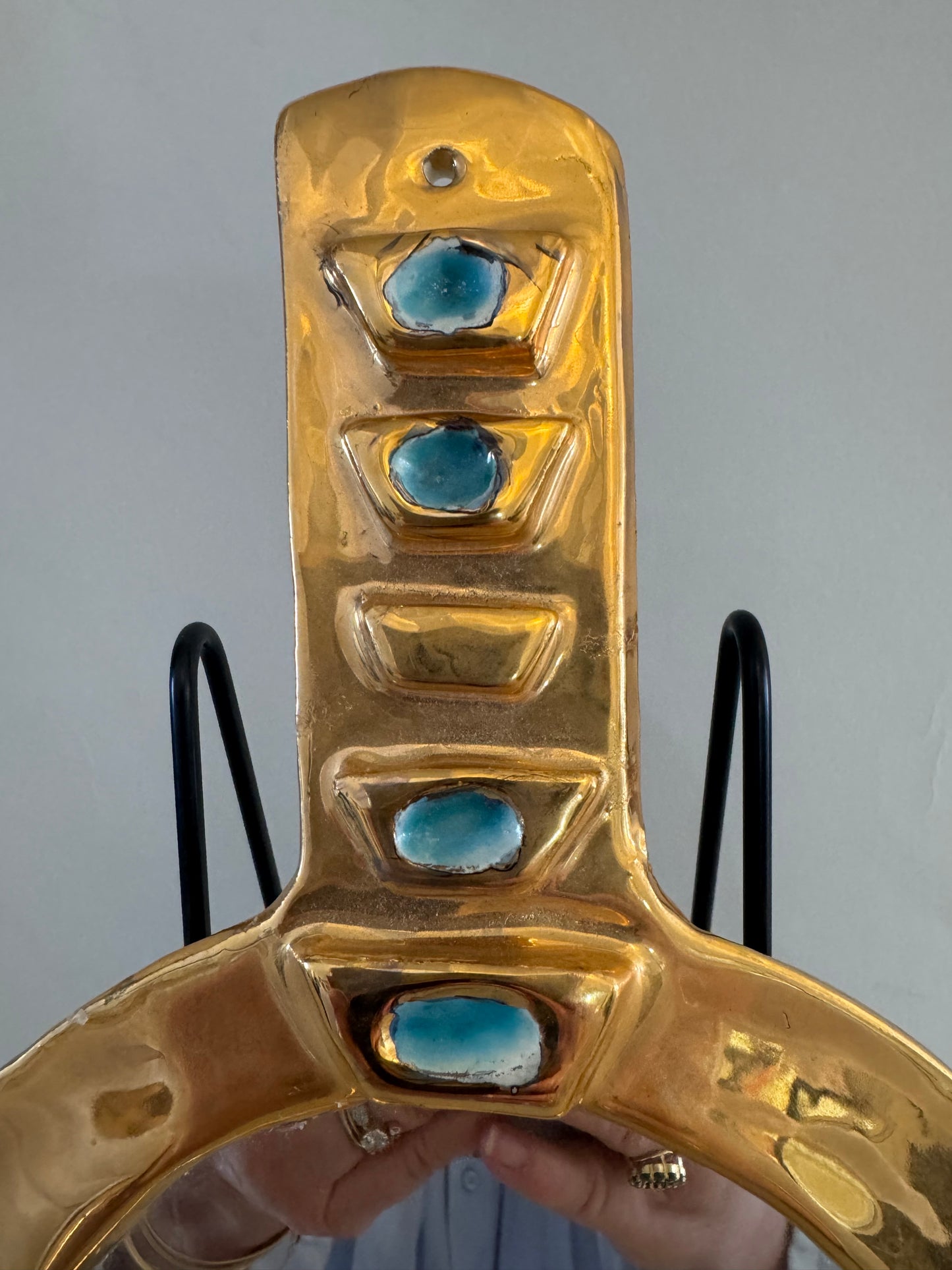 Small round ceramic mirror with gold luster glaze