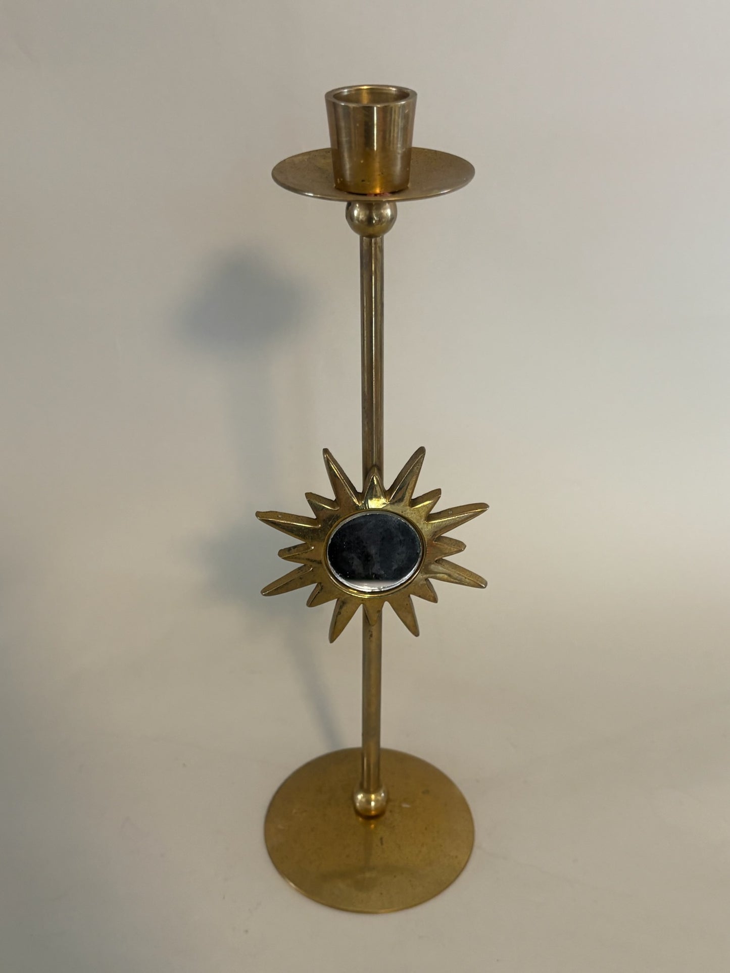 Mid-century brass candle holder with mirrored sunburst