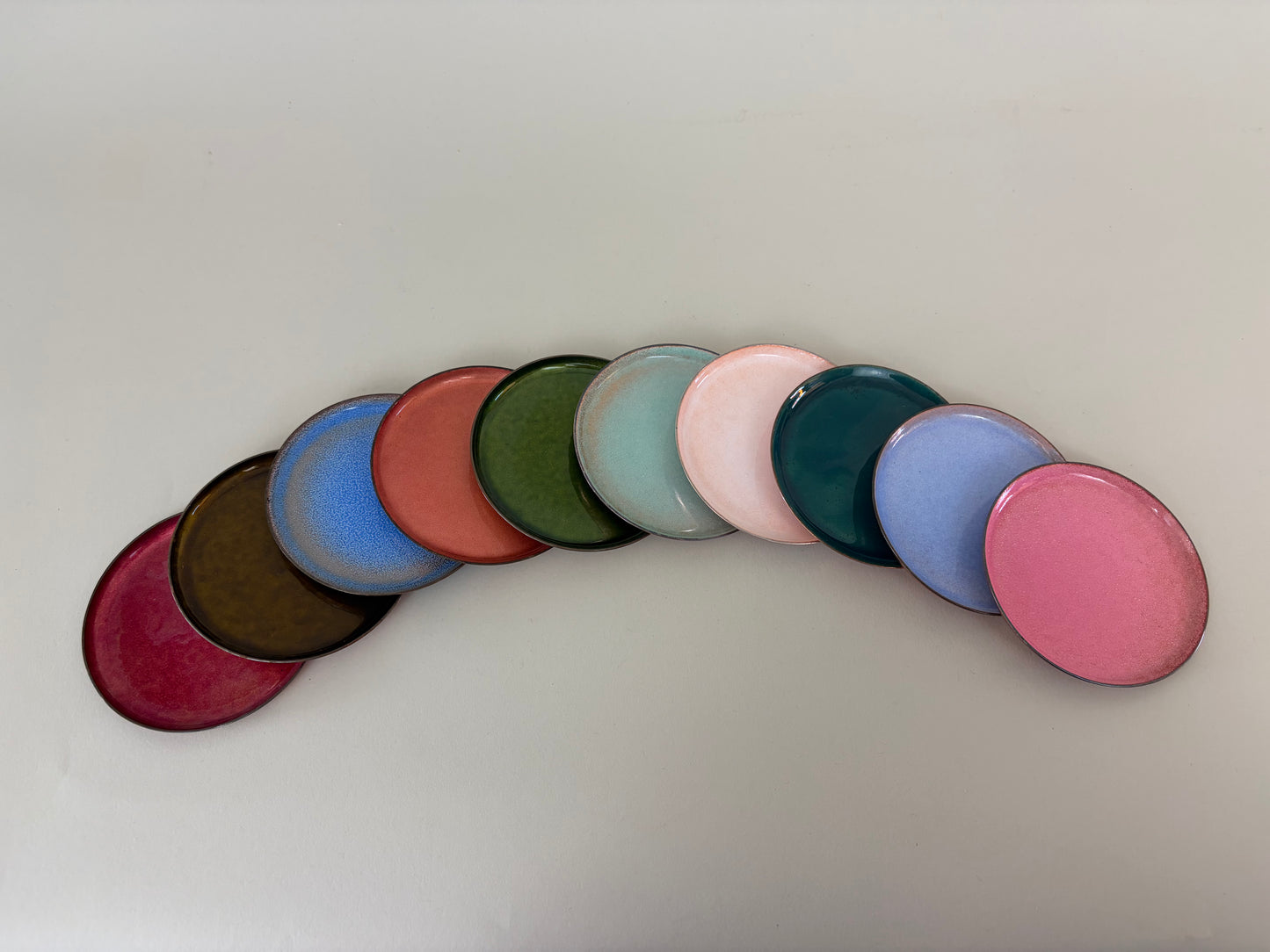 Set of 10 Mid Century Colored Enameled and Copper Coasters